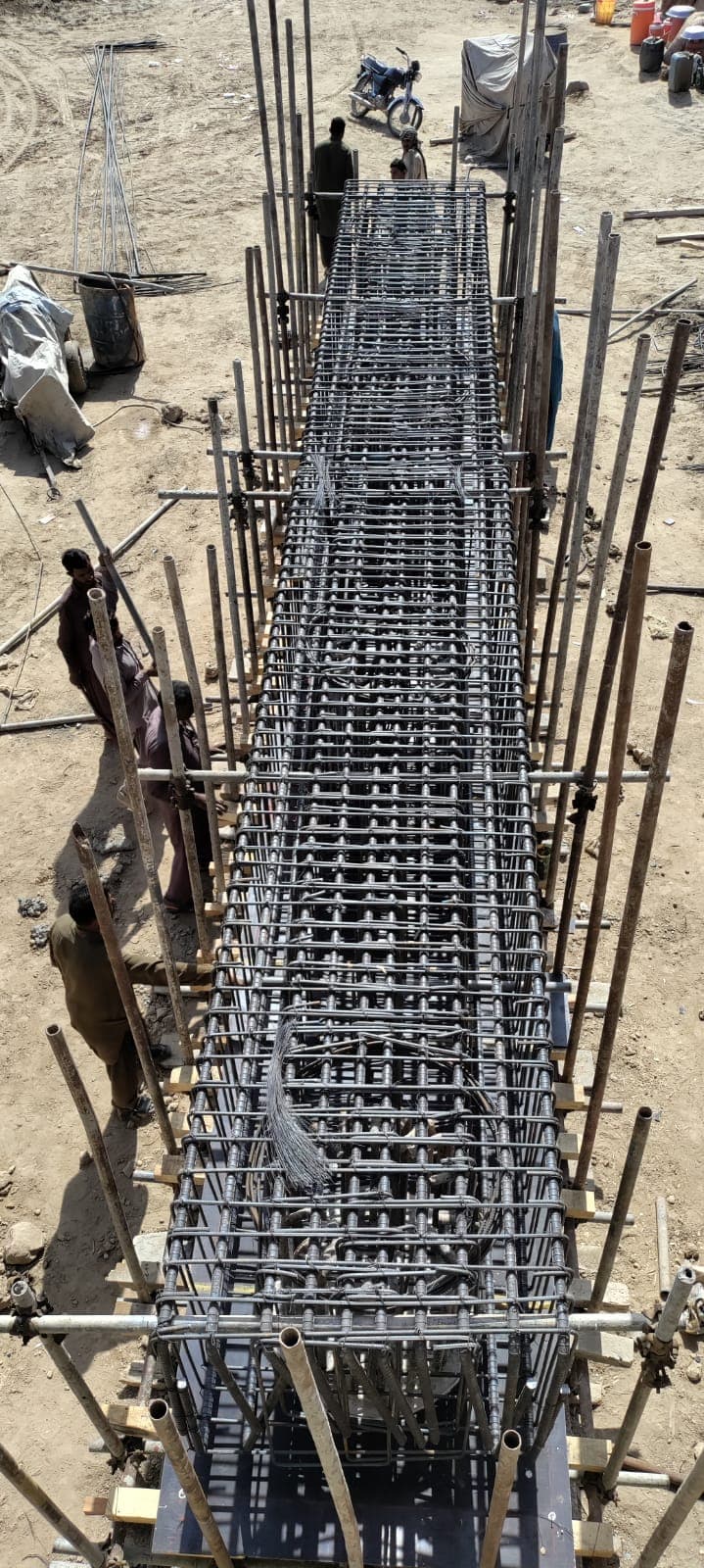 Rebar cage for a bridge girder being tied on site