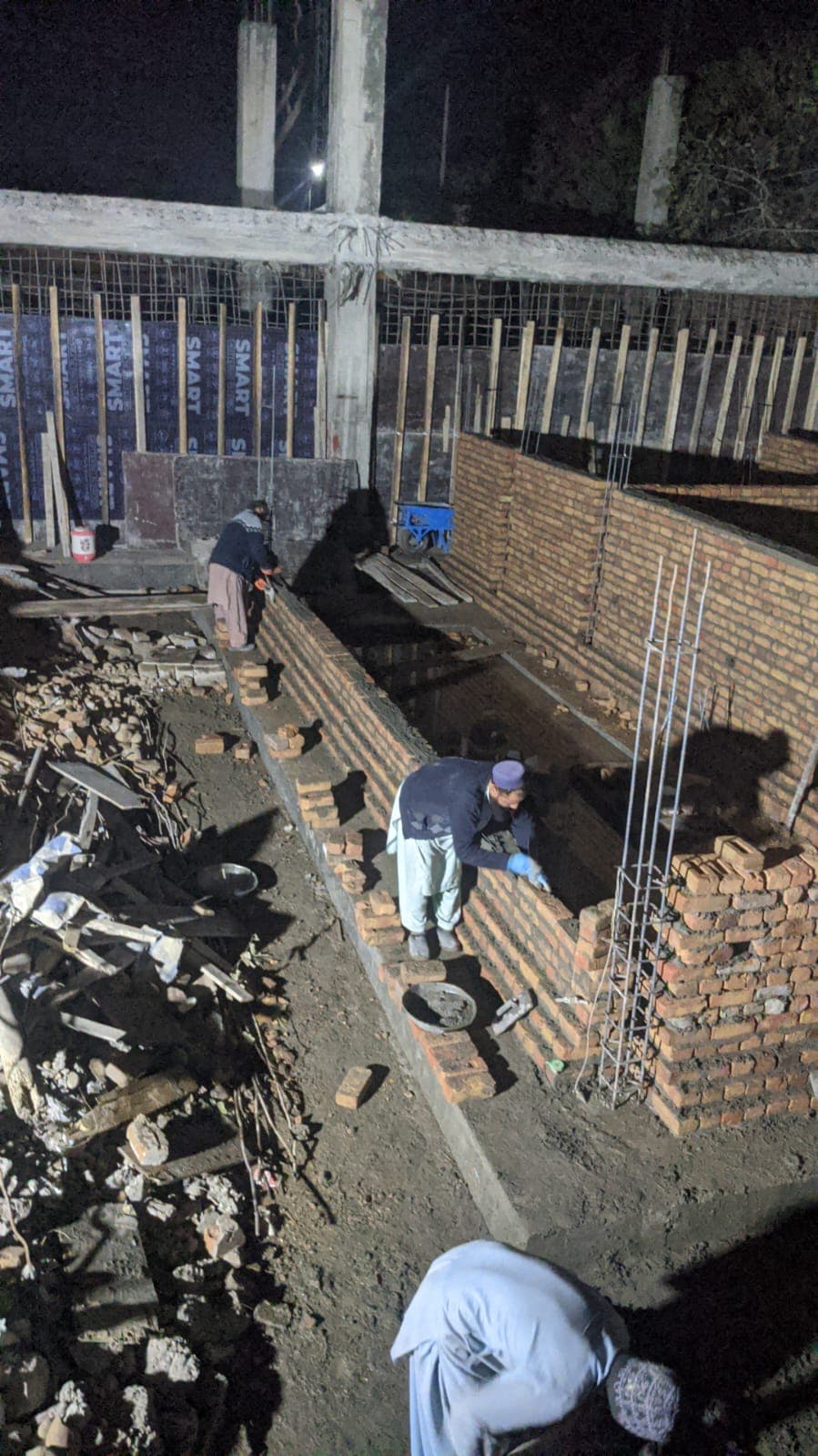 Brick masonry and foundation work in progress on site