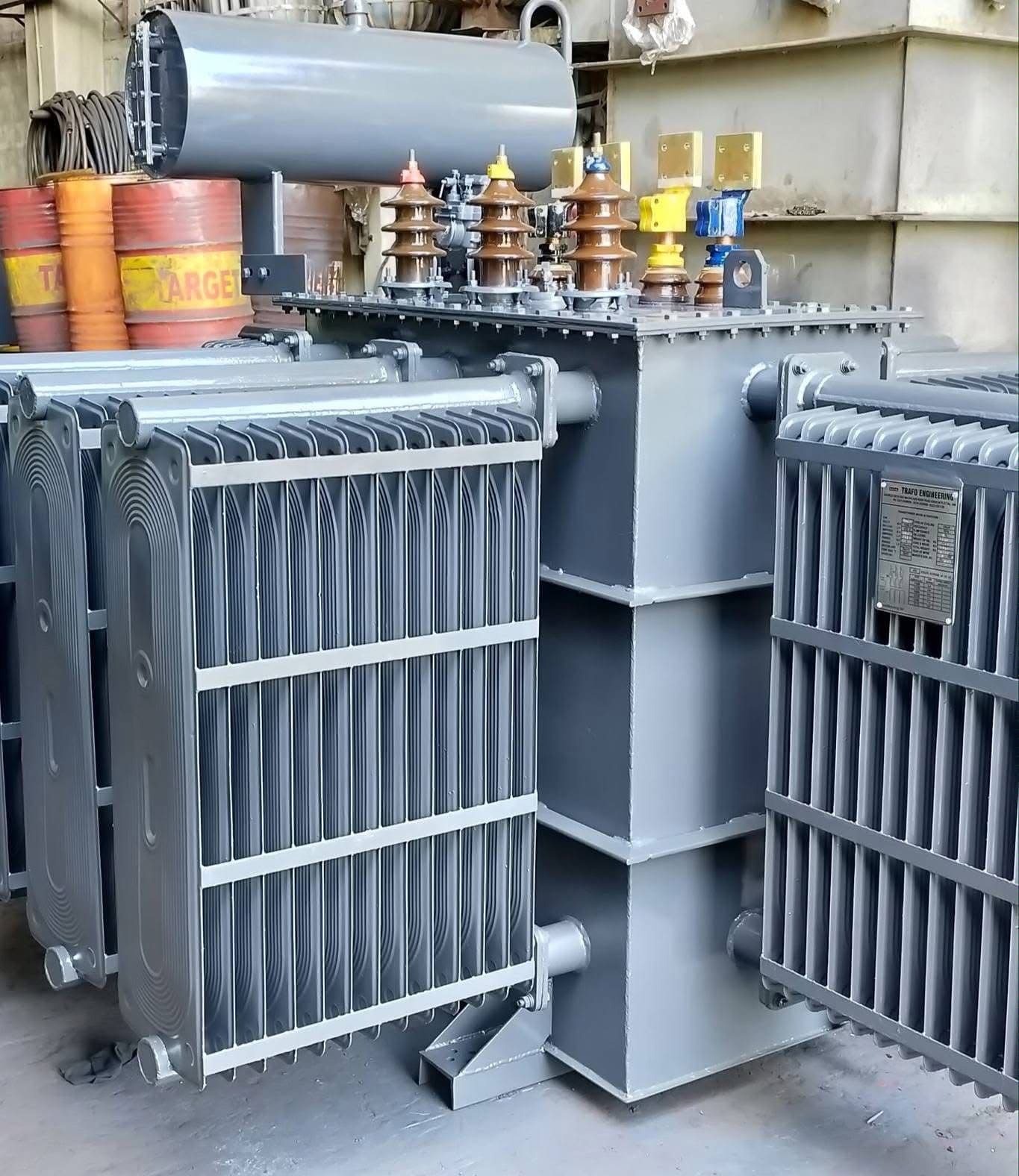 Oil-filled power transformer with radiators and bushings