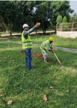 Site workers in high-visibility safety gear and helmets on a project site